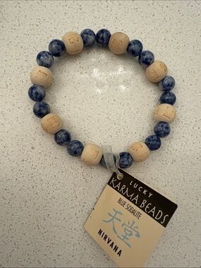 NIRVANA Blue Sodalite and Beige Lucky Karma Beads Bracelet